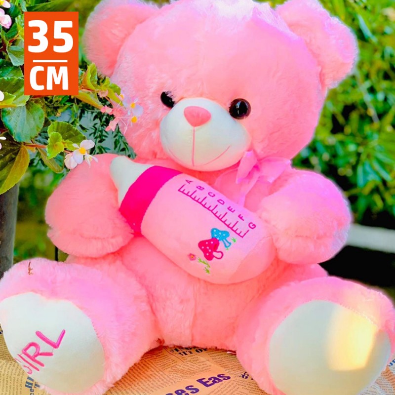 ⁦لعب أطفال قماش على شكل دبدوب يحمل الرضاعة طول 35 سم⁩ - الصورة ⁦1⁩