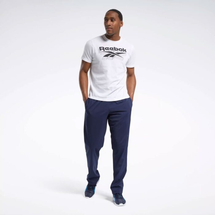 ⁦بنطلون ريبوك ويفن انلاين للرجال لون كحلي - Reebok Men's Training Essentials Woven Unlined Pants - Navy⁩ - الصورة ⁦4⁩