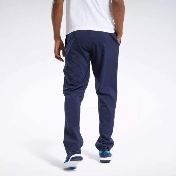 ⁦بنطلون ريبوك ويفن انلاين للرجال لون كحلي - Reebok Men's Training Essentials Woven Unlined Pants - Navy⁩ - الصورة ⁦5⁩