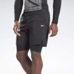 ⁦Reebok Mens' Epic Two-in-One Short - شورت ريبوك ايبك تو ان ون للرجال لون أسود⁩ - الصورة ⁦2⁩