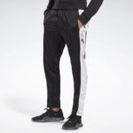 ⁦Reebok Mens' Te Vector Track Pants - بنطلون ريبوك تي فيكتور للرجال لون أسود⁩ - الصورة ⁦2⁩