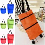 ⁦شنطة تسوق وتحمل عالأكتاف مع عجلات لون أحمر⁩ - الصورة ⁦2⁩