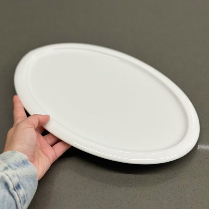 10321089_67db746416b33 جاط بورسلان بيضاوي32.5*22*1.5 - الصورة 1