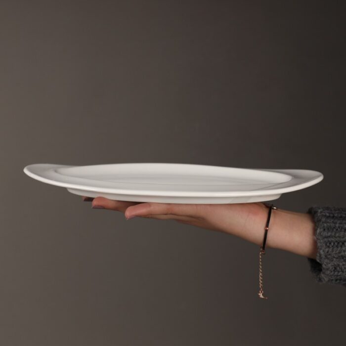 ⁦صحن بورسلان بيضاوي لون أبيض قياس 30*21 سم⁩ - الصورة ⁦2⁩