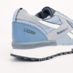 ⁦حذاء ريبوك ال اكس 2200 للرجال لون رمادي وأزرق ونعل أبيض - Reebok Mens' LX2200 Casual Shoes⁩ - الصورة ⁦3⁩