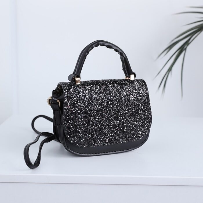 10333998_67dc476843a17 حقيبة يد للاطفال لون اسود - الصورة 1