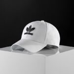 ⁦طاقية اديداس تريفول بيسبول للجنسين لون ابيض-adidas Unisex' Trefoil Baseball Cap White⁩ - الصورة ⁦11⁩