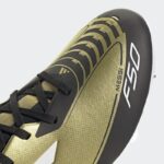 ⁦adidas Unisex' F50 League Messi Firm/Multi-Ground Soccer Cleats Boots - Gold - حذاء اديداس اف 50 ليجا ميسي فيرم ملتي جراوند للجنسين لون ذهبي وابيض⁩ - الصورة ⁦7⁩