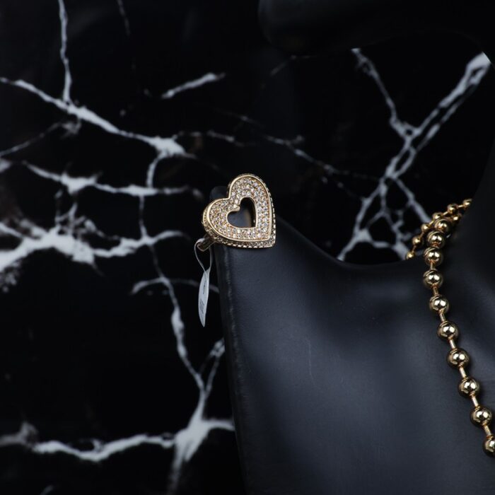 ⁦طقم اكسسوارات 3 قطع بتصميم قلب لون ذهبي حجم 6⁩ - الصورة ⁦3⁩
