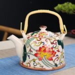 ابريق شاي بورسلان مع مصفاة لون طحيني مورد برتقالي