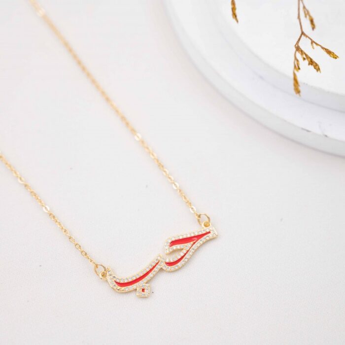 10337159_67dc5d811b2b6 سلسال ذهبي بتصميم كلمة حب لون أحمر - الصورة 1