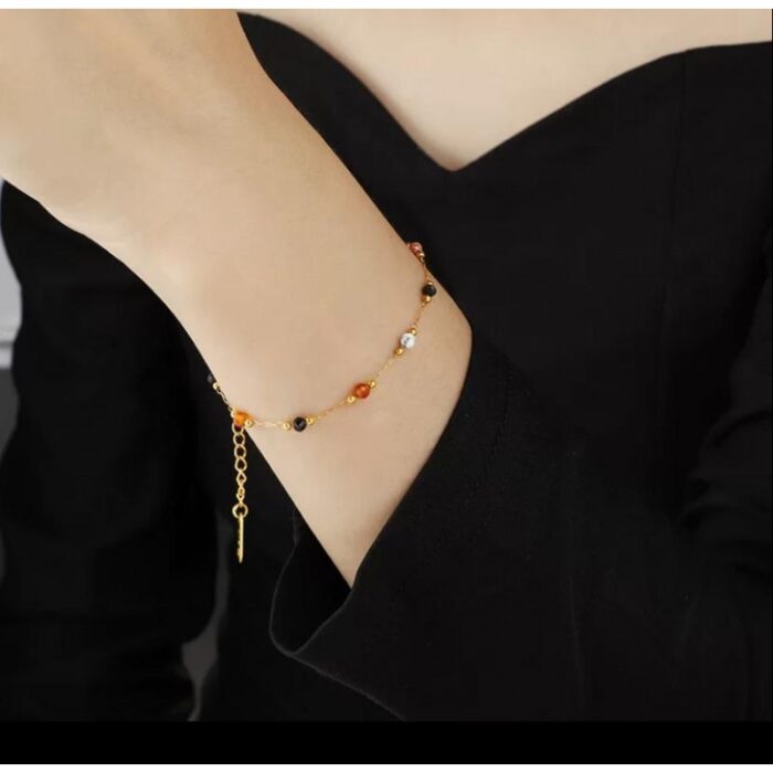 103374767_67dc6210c4173 سوار ذهبي بتصميم خرز ملون - الصورة 1