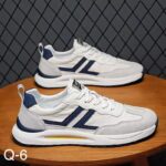 حذاء رياضي لون أبيض وسكري وكحلي