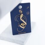 حلق ذهبي بتصميم أفعى زركون أخضر