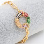 سوار ذهبي بتصميم جنزير ودائرة زركون ملون
