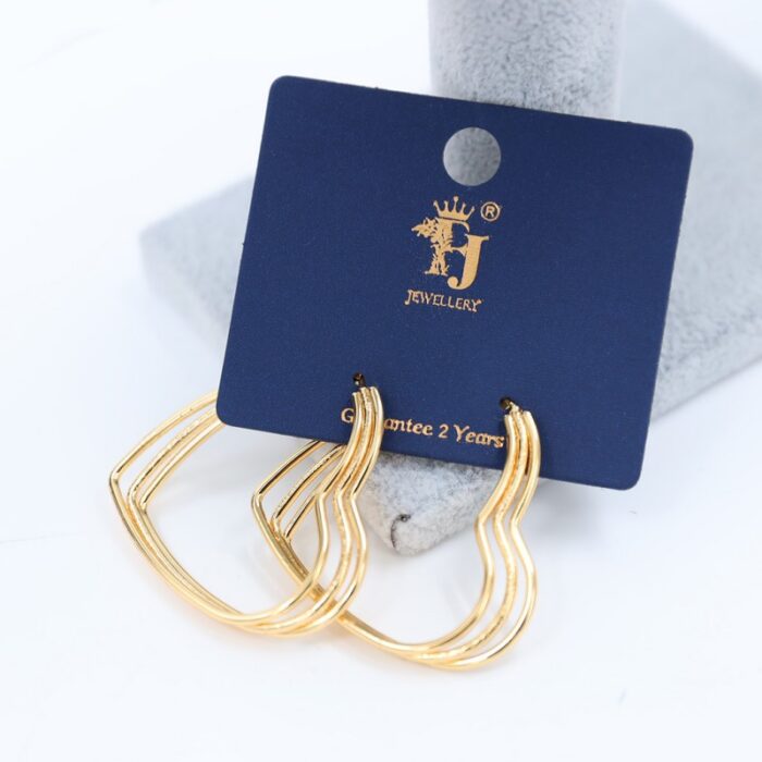 ⁦حلق قلوب 3 طبقات لون ذهبي⁩ - الصورة ⁦1⁩