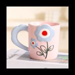 ⁦مج بتصميم وردة يد عريضة لون زهري⁩ - الصورة ⁦2⁩