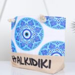 ⁦شنطة يد قماش للرحلات بتصميم عين لون أبيض⁩ - الصورة ⁦2⁩