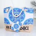 ⁦شنطة يد قماش للرحلات بتصميم عين لون أبيض⁩ - الصورة ⁦3⁩