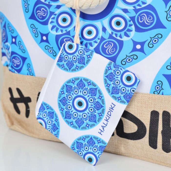 ⁦شنطة يد قماش للرحلات بتصميم عين لون أبيض⁩ - الصورة ⁦4⁩