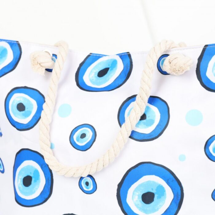 ⁦شنطة يد قماش للرحلات بتصميم عيون لون أبيض⁩ - الصورة ⁦3⁩