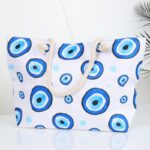 ⁦شنطة يد قماش للرحلات بتصميم عيون لون أبيض⁩ - الصورة ⁦4⁩