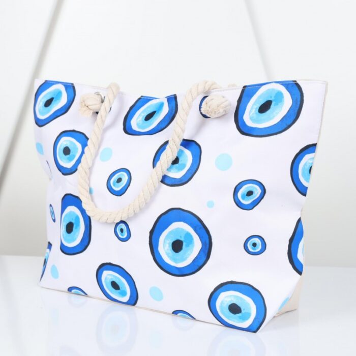⁦شنطة يد قماش للرحلات بتصميم عيون لون أبيض⁩ - الصورة ⁦5⁩