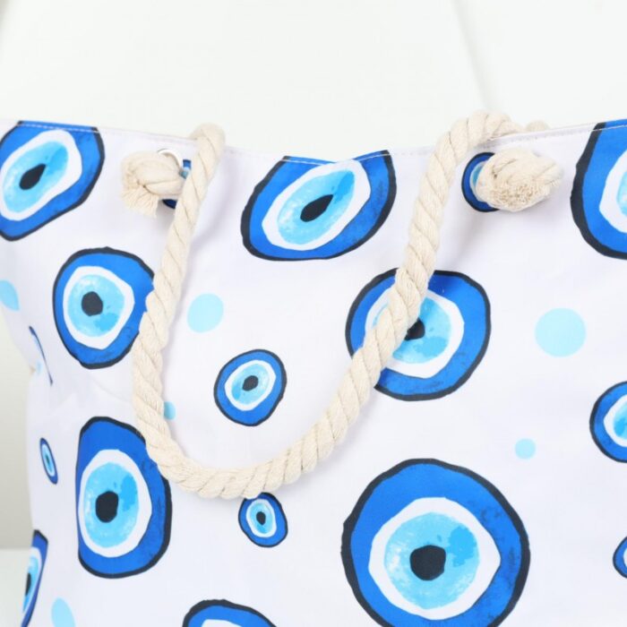⁦شنطة يد قماش للرحلات بتصميم عيون لون أبيض⁩ - الصورة ⁦6⁩
