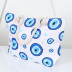 ⁦شنطة يد قماش للرحلات بتصميم عيون لون أبيض⁩ - الصورة ⁦7⁩