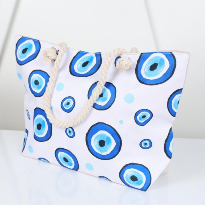 ⁦شنطة يد قماش للرحلات بتصميم عيون لون أبيض⁩ - الصورة ⁦7⁩