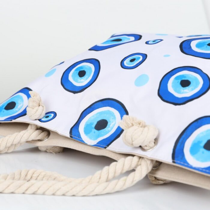 ⁦شنطة يد قماش للرحلات بتصميم عيون لون أبيض⁩ - الصورة ⁦8⁩