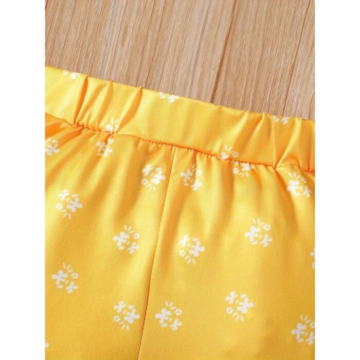 103378542_67de14d1c7845 طقم فستان مع بنطلون للأطفال لون أصفر - الصورة 1