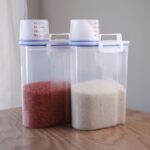 علبة تخزين بلاستيك مع كوب معياري 22.5 * 11.5* 15سم ( 2 ونص كيلو غرام)