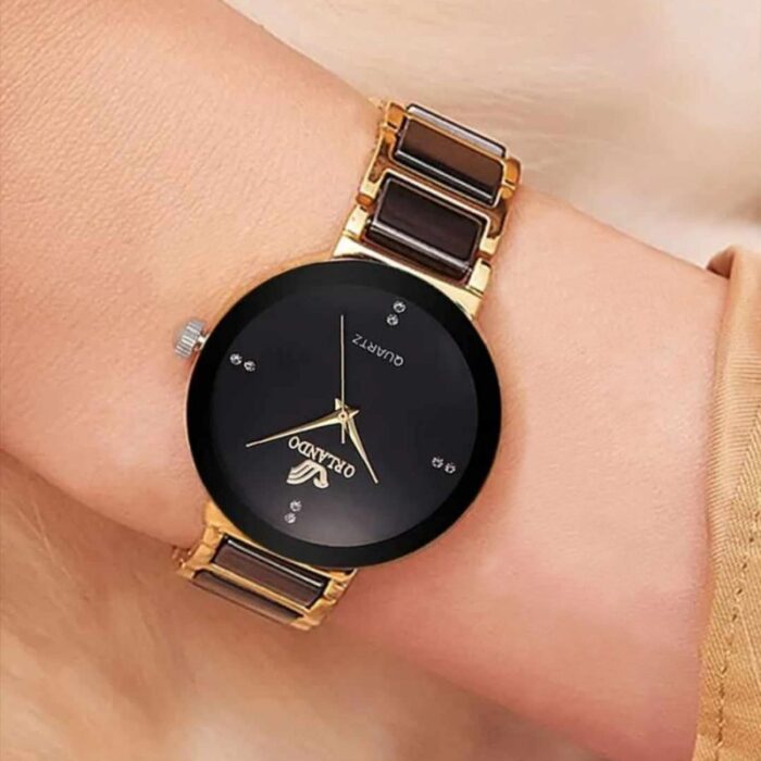 ⁦ساعة معدنيه دائرة صغيرة ذهبي و اسود⁩ - الصورة ⁦3⁩