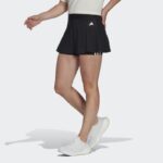 ⁦adidas Women's Training Essentials 3 Stripes Skirt- تنوره رياضية اديداس ايسينشيال ثلاث خطوط للنساء لون أسود⁩ - الصورة ⁦3⁩