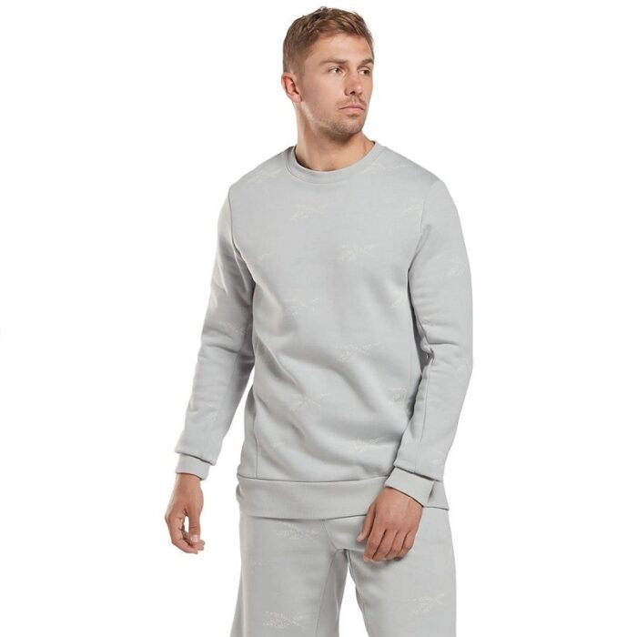 10326353_67fac079c916d Reebok Men Identity Vector Fleece Crew Sweatshirt- تيشيرت ريبوك بأكمام طويلة لون سكني للرجال - الصورة 1