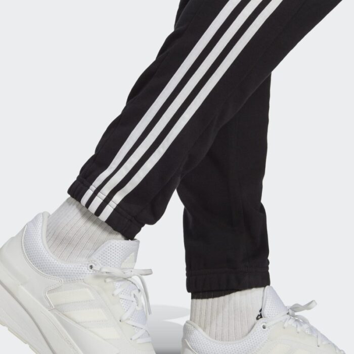 10335028_67faca099f310 بنطلون اديداس للرجال لون اسود-adidas Men's Essentials French Terry Tapered Elastic Cuff 3-Stripes Joggers Pants - الصورة 1