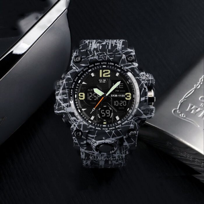 10335477_67facae92ef96 ساعة يد سيليكون للرجال لون أسود ورمادي من Skmei - الصورة 1
