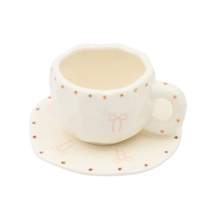 ⁦فنجان مع صحن لون أبيض بتصميم ببيونة⁩ - الصورة ⁦4⁩