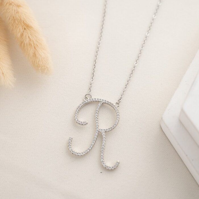 10334612_685e85696b656 سلسال فضي زركون بتصميم حرف R - الصورة 1