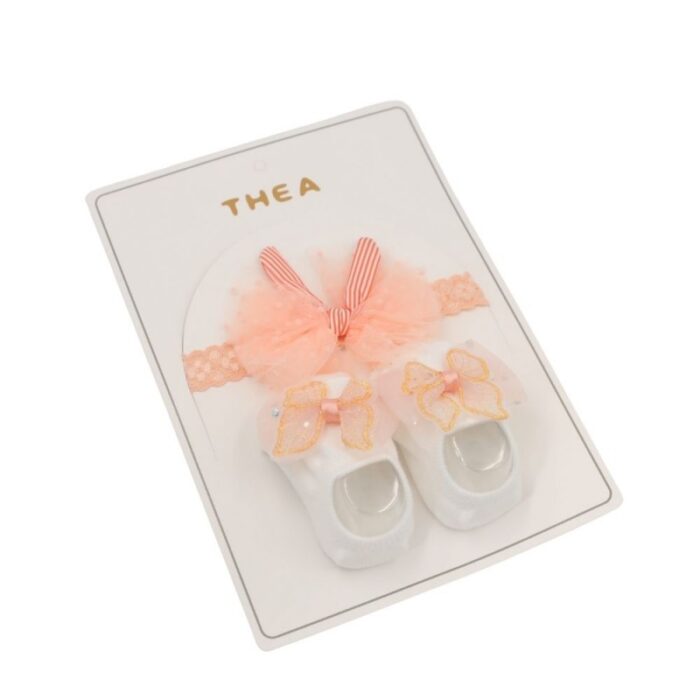 103380291_685eaea17ca6f طقم للأطفال قطعتين لون أبيض و مشمشي - الصورة 1