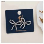 حلق شكل ببيونة لون فضي