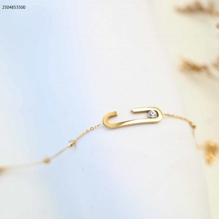 103385046_685ecc7fb6a0e سوار بتصميم بيضاوي مع زركون لون ذهبي - الصورة 1