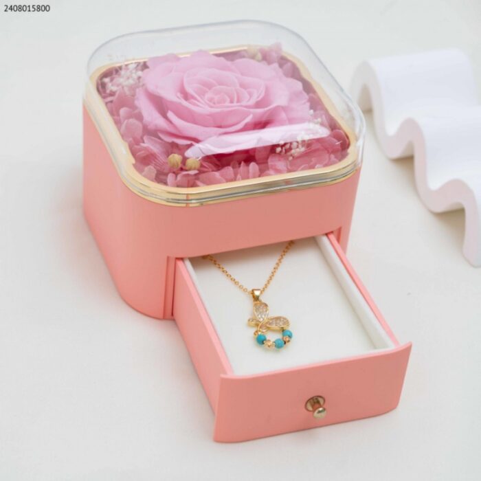 103387129_688f850c3e1a1 صندوق هدايا للمجوهرات زهري وذهبي مع ورد زهري - الصورة 1