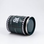 صندوق هدايا معدن شبابي للساعه شكل اسطوانه لون اسكني غامق بتفاصيل أبيض وأسود