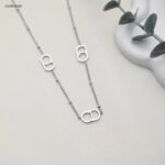 سلسال ماركة طويل حرفي C D متداخلين لون فضي