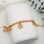 سوار مع حلقات متدلي شكل ورد لون ذهبي