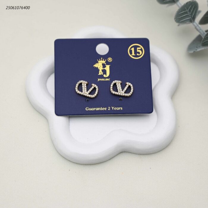 103392285_68e2e80f23720 حلق ماركة مع زركون لون ذهبي - الصورة 1