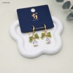 حلق أذن متدلي بتصميم فيونكة وكريستال على شكل دمعة لون ذهبي