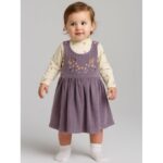 فستان لون نهدي مع بلوزة بيضاء